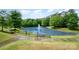 Scenic pond with a fountain and walking path, offering a tranquil outdoor escape at 15554 Stronvar House Ln, Charlotte, NC 28277