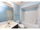 Bright bathroom with a vanity, toilet, and a shower-tub combination at 15623 Sir Charles Pl, Charlotte, NC 28277