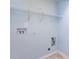 The laundry room features white wire shelving and light blue walls at 15623 Sir Charles Pl, Charlotte, NC 28277