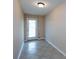 Small, bright room featuring tile floors and a door with window blinds leading to the outside at 15623 Sir Charles Pl, Charlotte, NC 28277