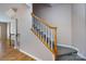 Staircase with carpeted stairs and railing with access to the second floor at 15623 Sir Charles Pl, Charlotte, NC 28277