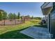 Well-maintained backyard with a patio and manicured lawn, perfect for outdoor entertaining at 16042 River Tree Ln, Charlotte, NC 28278