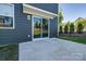 A quaint patio space accessible through a sliding glass door enhances outdoor living at 16042 River Tree Ln, Charlotte, NC 28278