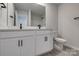 Bathroom with double vanity and toilet at 16042 River Tree Ln, Charlotte, NC 28278