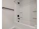 Clean bathtub with shower head and black towel bar at 16042 River Tree Ln, Charlotte, NC 28278