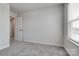 Carpeted bedroom with neutral walls and a bright window at 16042 River Tree Ln, Charlotte, NC 28278