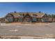 Community clubhouse with elegant stone and siding exterior provides a gathering space at 16042 River Tree Ln, Charlotte, NC 28278