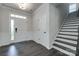 Bright and airy entryway with hardwood floors, staircase, and front door with sidelight at 16042 River Tree Ln, Charlotte, NC 28278
