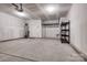 A clean, unfinished two-car garage features utility sink and ample storage space at 16042 River Tree Ln, Charlotte, NC 28278