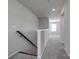 Carpeted upstairs hallway featuring a light colored wall paint and window at 16042 River Tree Ln, Charlotte, NC 28278