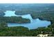 Breathtaking aerial view of a lake surrounded by dense green forests, showcasing the natural beauty of the area at 1610 Ford St, Charlotte, NC 28216