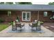 Cozy backyard patio with outdoor seating, perfect for relaxing and enjoying the private brick home and landscaped surroundings at 1610 Ford St, Charlotte, NC 28216