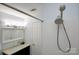 Bathroom with a new showerhead and vanity, and large mirror at 1610 Ford St, Charlotte, NC 28216