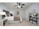 This bedroom features a modern ceiling fan, neutral walls, and soft carpet flooring at 1610 Ford St, Charlotte, NC 28216