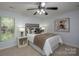 Cozy bedroom with neutral tones, a comfortable bed, and ample natural light at 1610 Ford St, Charlotte, NC 28216