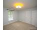 Bedroom with natural light, large window, and ceiling fan at 1610 Ford St, Charlotte, NC 28216
