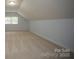 This bonus room features carpet flooring, natural light, and neutral paint at 1610 Ford St, Charlotte, NC 28216