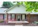 Inviting front porch with rocking chairs and porch swing, perfect for enjoying the outdoors at 1610 Ford St, Charlotte, NC 28216