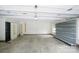 Bright and clean garage space offers ample room for parking and storage, along with convenient shelving at 1610 Ford St, Charlotte, NC 28216