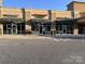 Retail strip featuring N.V. Nail Spa, Romeo & Julieta Pizzeria, and Collins Cleaners with street parking at 1610 Ford St, Charlotte, NC 28216