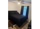 Cozy bedroom with dark bedding, a cowhide rug, and window that provides great natural light at 1623 Flagler Ln, Charlotte, NC 28216