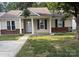 Charming single-story home featuring a well-maintained lawn, brick accents, and classic blue shutters at 1623 Flagler Ln, Charlotte, NC 28216