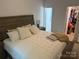 Calm bedroom with a large bed, plush pillows, and a walk-in closet, providing ample storage at 1623 Flagler Ln, Charlotte, NC 28216