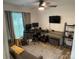 Functional office features multiple monitors, a comfortable seating area, and ample workspace at 1623 Flagler Ln, Charlotte, NC 28216