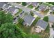 Overhead view of a home in a suburban neighborhood with mature trees and well-maintained lawns at 16615 Crimson Sargent Dr, Charlotte, NC 28213