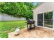 Spacious backyard with a grill and concrete patio, perfect for summer cookouts and outdoor entertaining at 16615 Crimson Sargent Dr, Charlotte, NC 28213