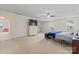 Spacious bedroom with carpet, ceiling fan, flat screen television, and plenty of natural light at 16615 Crimson Sargent Dr, Charlotte, NC 28213