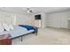 Large bedroom with light-colored carpet, a ceiling fan, flat screen TV, and ensuite bathroom entrance at 16615 Crimson Sargent Dr, Charlotte, NC 28213
