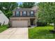 Traditional brick two-story home with a two-car garage and well-maintained front lawn at 16615 Crimson Sargent Dr, Charlotte, NC 28213