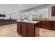 Open kitchen showcases a large island with granite countertops and seamless flow to the living area at 16615 Crimson Sargent Dr, Charlotte, NC 28213