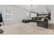 Spacious living room features large grey sectional and views of the kitchen and breakfast area at 16615 Crimson Sargent Dr, Charlotte, NC 28213