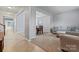 Open living space connecting the living room and dining area, with neutral decor and ample natural light at 16615 Crimson Sargent Dr, Charlotte, NC 28213