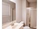 Bathroom with a glass-doored shower, and a well-lit vanity with mirror at 1708 Dogwood Ln, Lancaster, SC 29720