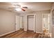 Neutral bedroom featuring wood-look flooring, closet space and a ceiling fan at 1708 Dogwood Ln, Lancaster, SC 29720