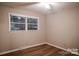 Bright bedroom featuring a ceiling fan, and wood-look flooring, providing a comfortable and stylish space at 1708 Dogwood Ln, Lancaster, SC 29720