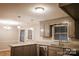 Eat-in kitchen features stainless steel appliances and gray cabinetry at 1708 Dogwood Ln, Lancaster, SC 29720