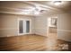 Spacious living room featuring vinyl plank flooring, ceiling fan and access to the kitchen at 1708 Dogwood Ln, Lancaster, SC 29720