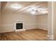 Open living room featuring a fireplace, ceiling fan, and luxury vinyl plank flooring at 1708 Dogwood Ln, Lancaster, SC 29720