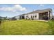 Spacious backyard featuring a patio and black metal fence, perfect for outdoor entertaining at 1825 Lotus Ln, Denver, NC 28037