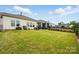 Large, well-maintained backyard with lush green grass and a black metal fence at 1825 Lotus Ln, Denver, NC 28037