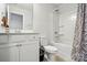Clean bathroom features a shower and tub combo with a white vanity at 1825 Lotus Ln, Denver, NC 28037