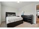 Cozy bedroom features a neutral paint and a bed with simple decor at 1825 Lotus Ln, Denver, NC 28037