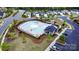 Aerial view of a community pool with lounge chairs and umbrellas at 1825 Lotus Ln, Denver, NC 28037