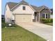 Inviting single-story home with a two-car garage, and a neat lawn at 1825 Lotus Ln, Denver, NC 28037