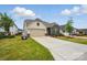 Beautifully landscaped single-Gathering home with a two-car garage and manicured lawn at 1825 Lotus Ln, Denver, NC 28037