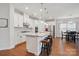 Open concept kitchen with a center island, modern appliances, and an adjacent dining area with a view at 1825 Lotus Ln, Denver, NC 28037